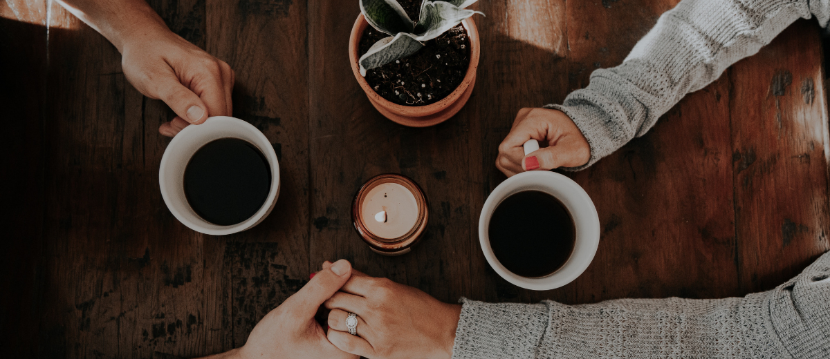 How Do You Get Your Spouse On Board With A Move? Couple making a decision over coffee